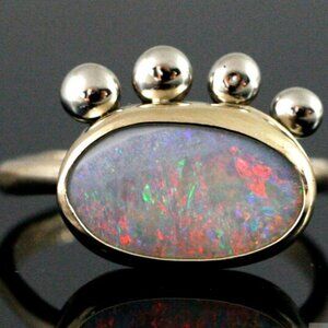 Solid 14k Gold and Australian Opal Ring. stunning and original in its design